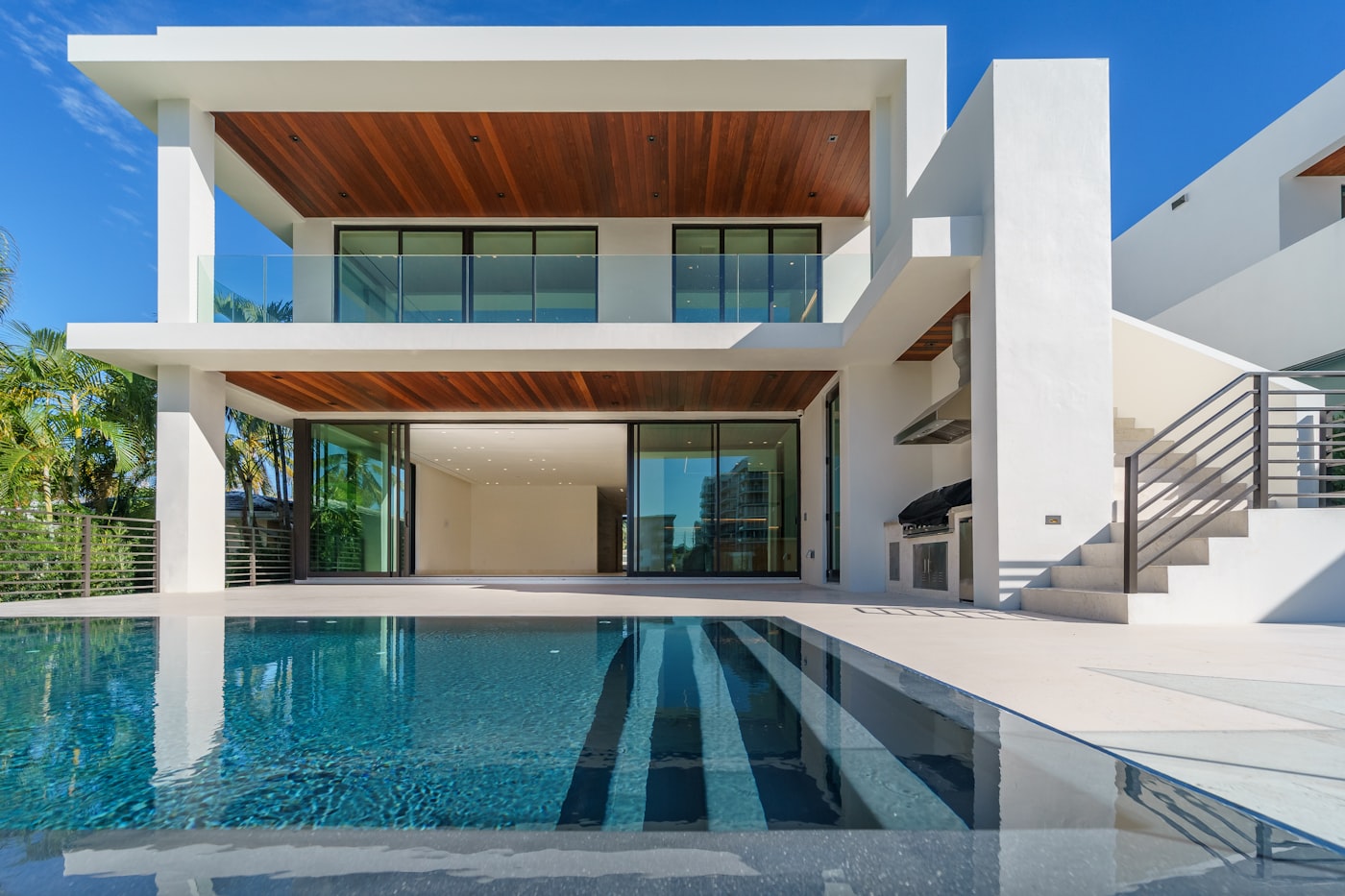 Modern residence facade surrounded by greenery